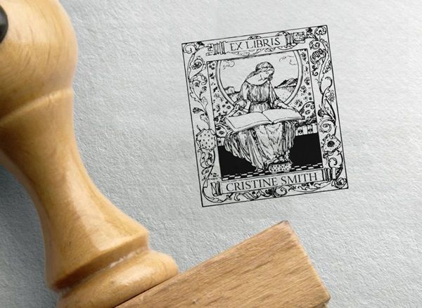 image of rubber stamp featuring woman reading