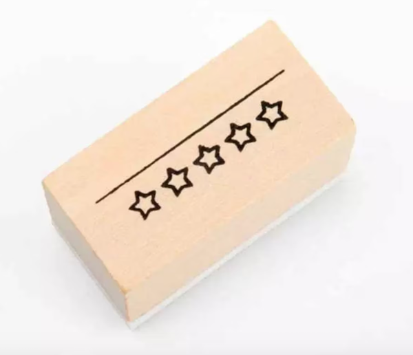 A wooden stamp for rating things out of 5 stars.