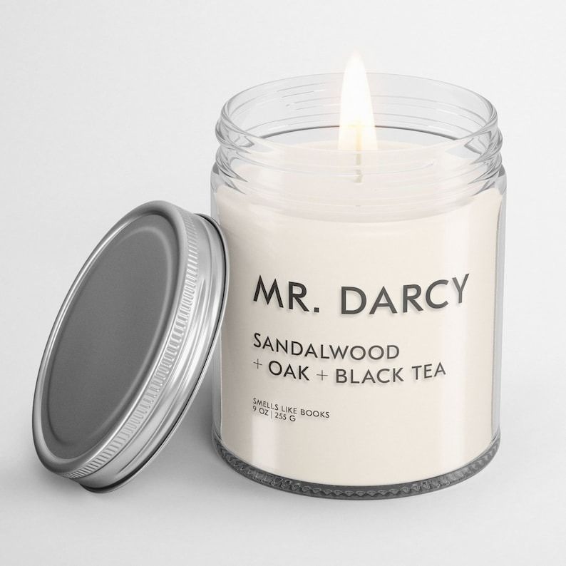a Mr. Darcy candle with the scents sandalwood + oak + black tea