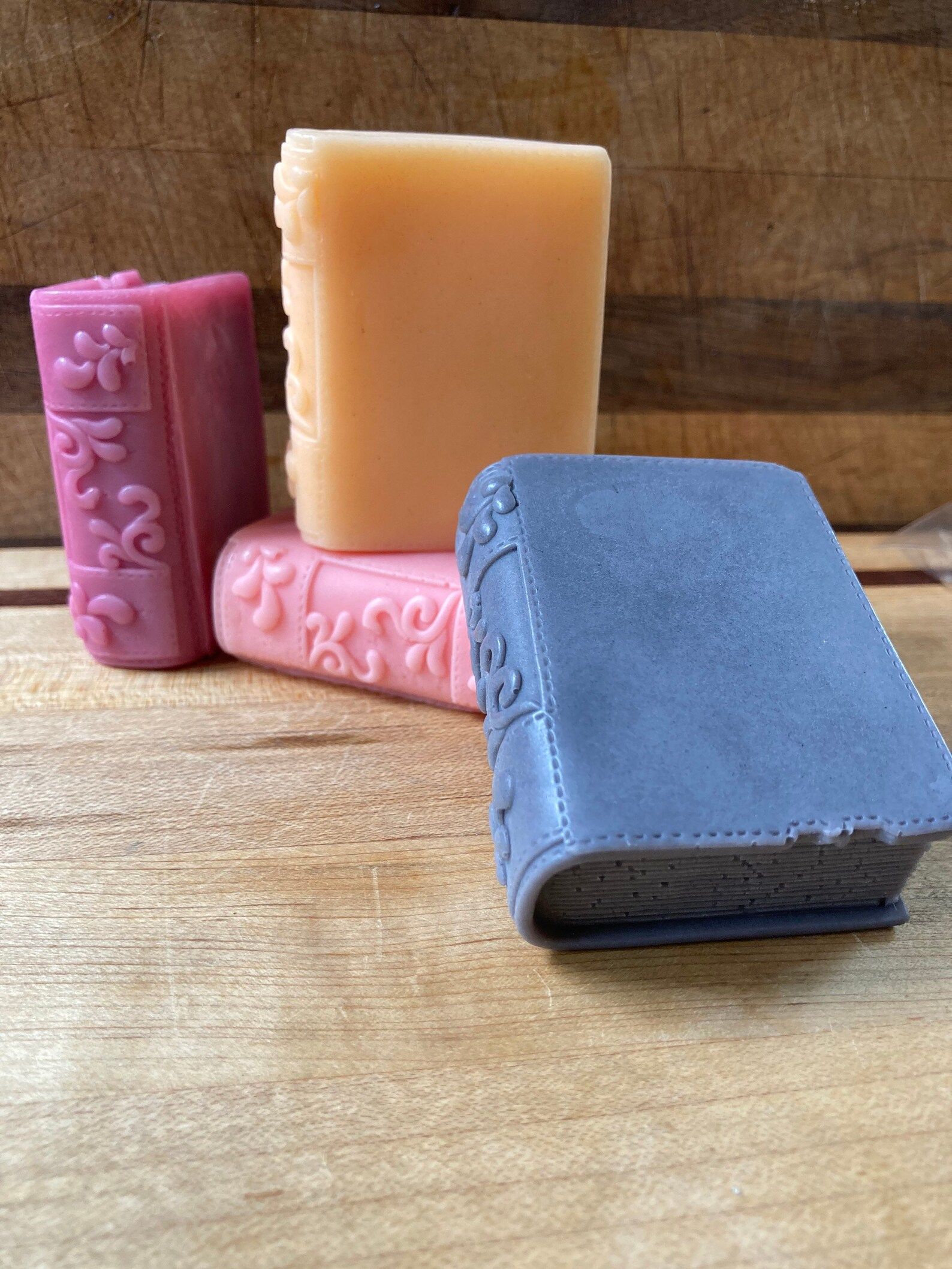 four bars of soap in the shape of leather-bound books