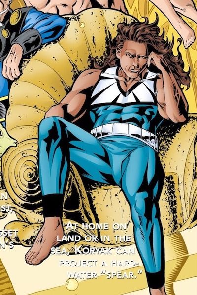 Part of a page from Aquaman Secret Files and Origins. Koryak, an Inuit man with medium brown skin and long dark hair, is slouched in a throne made of coral. He is wearing a blue and white costume. Below him is text reading "At home on land or in the sea, Koryak can project a hard-water 'spear.'"