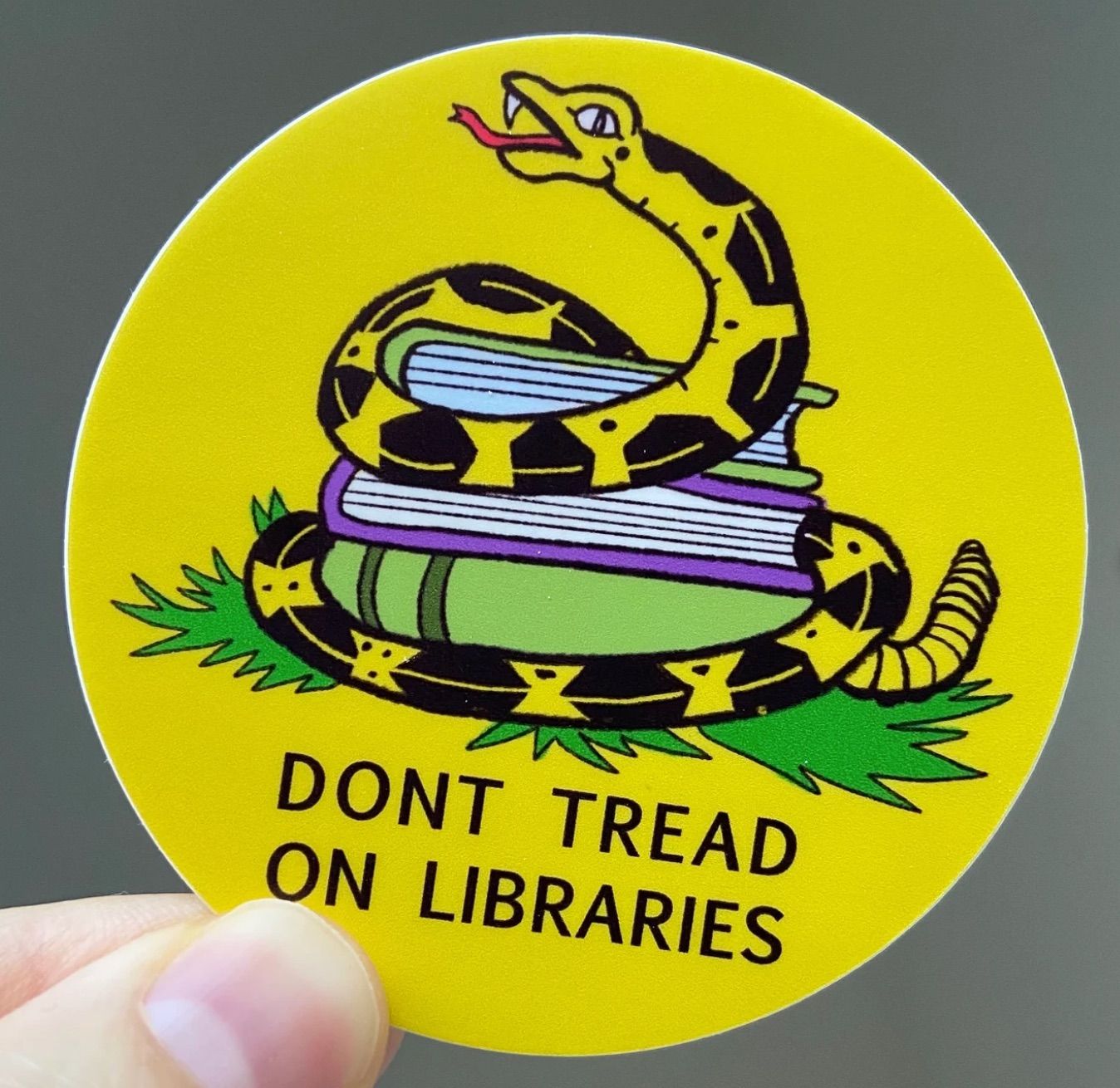 don't tread on me sticker with the text "don't tread on libraries."