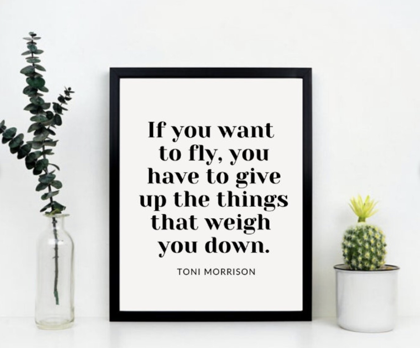 A print featuring a quote by Toni Morrison that says: "If you want to fly, you have to give up the things that weigh you down." 