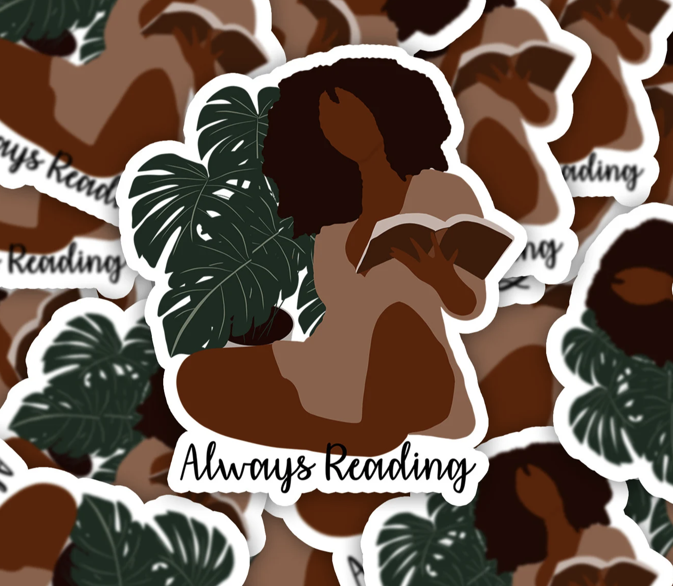 Sticker with a brown-skinned Black woman figure in a tan dress. Sicker is captioned "always reading"