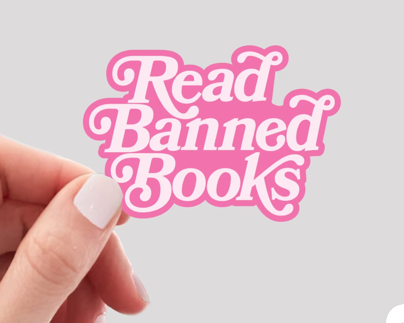 pink sticker that says "read banned books."