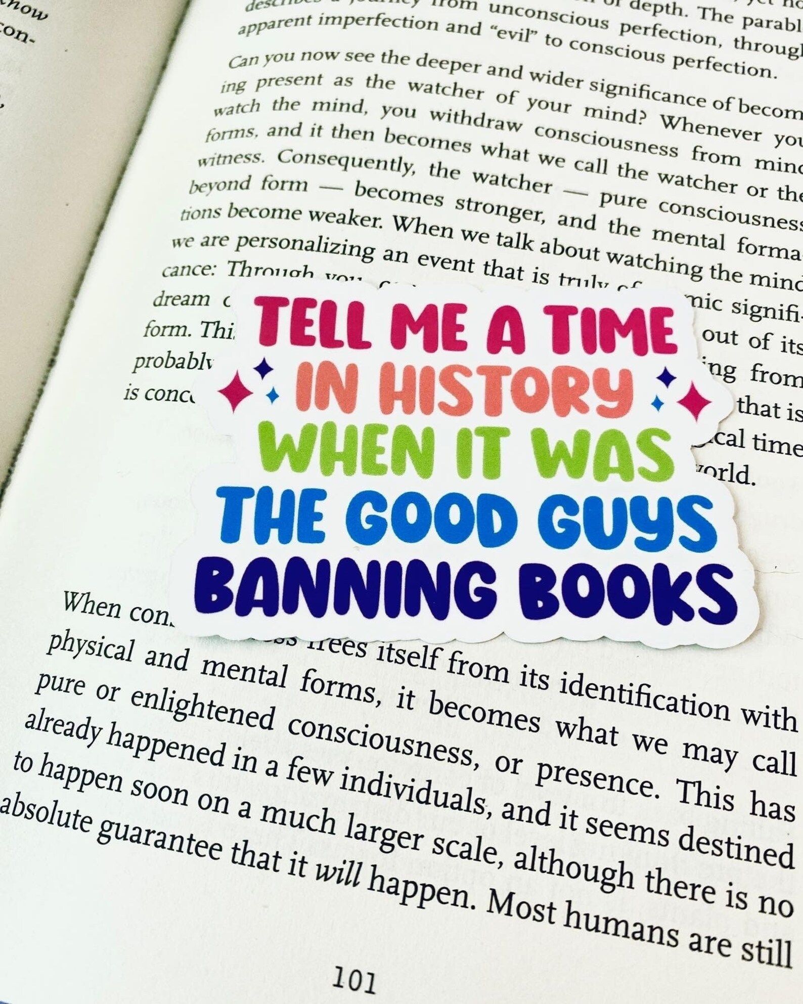 colorful sticker reading "tell me a time in history when it was the good guys banning books."
