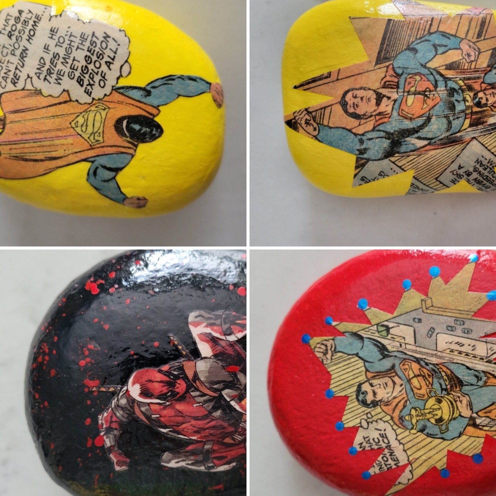 Four paperweights made from painted rocks with images from old superhero comics applied on top