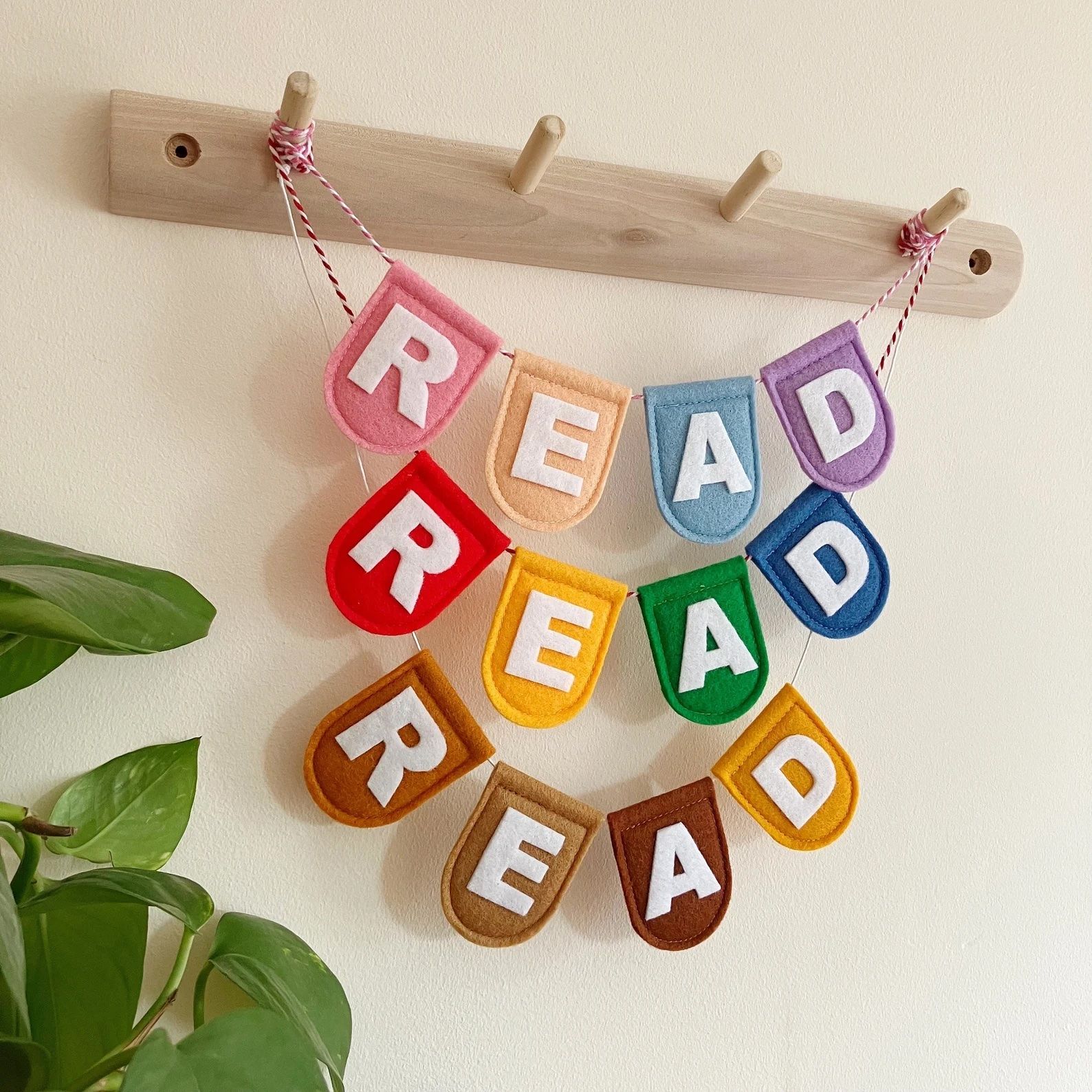 a photo of of three different garland, each in different colors that say "read"