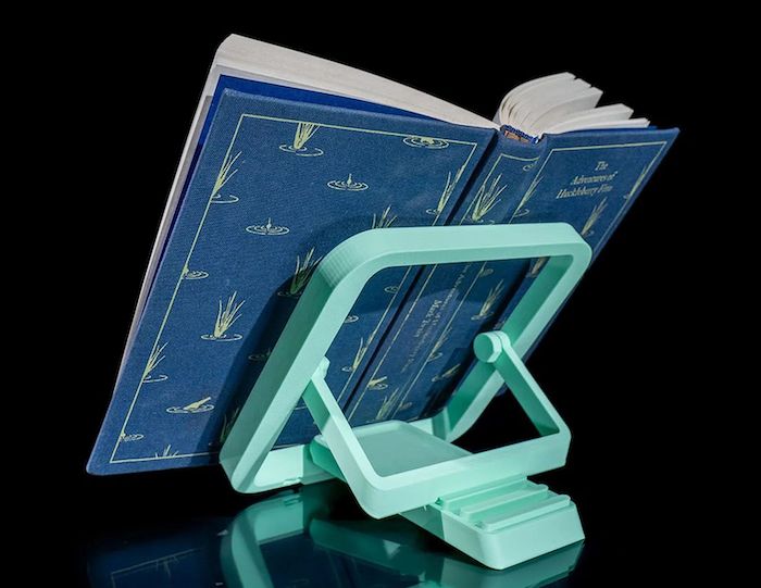 plastic book stand with book on it