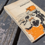 a used copy of Animal Farm held together with tape