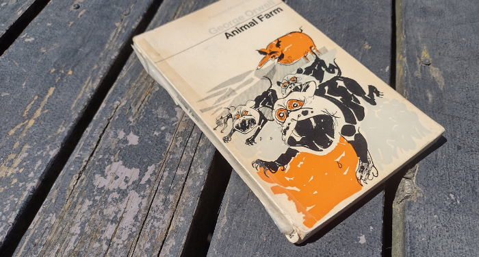 a used copy of Animal Farm held together with tape