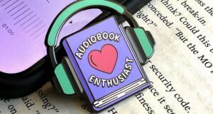 audiobook enthusiast enamel pin