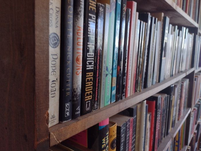 a close-up of a wall of bookshelves