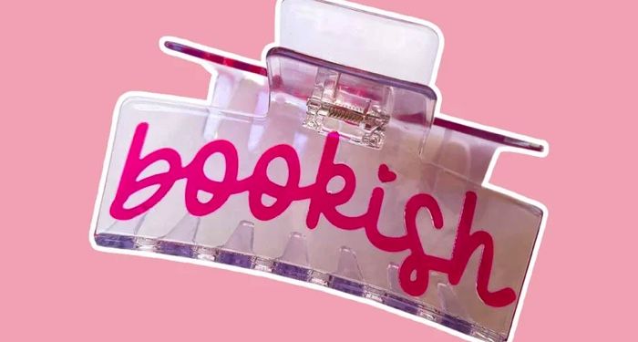 hair clip that says bookish set against a pink background