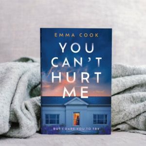 The book You Can't Hurt Me by Emma Cook, in front of a gray blanket