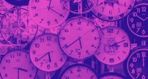 a pink-washed photo of multiple clocks