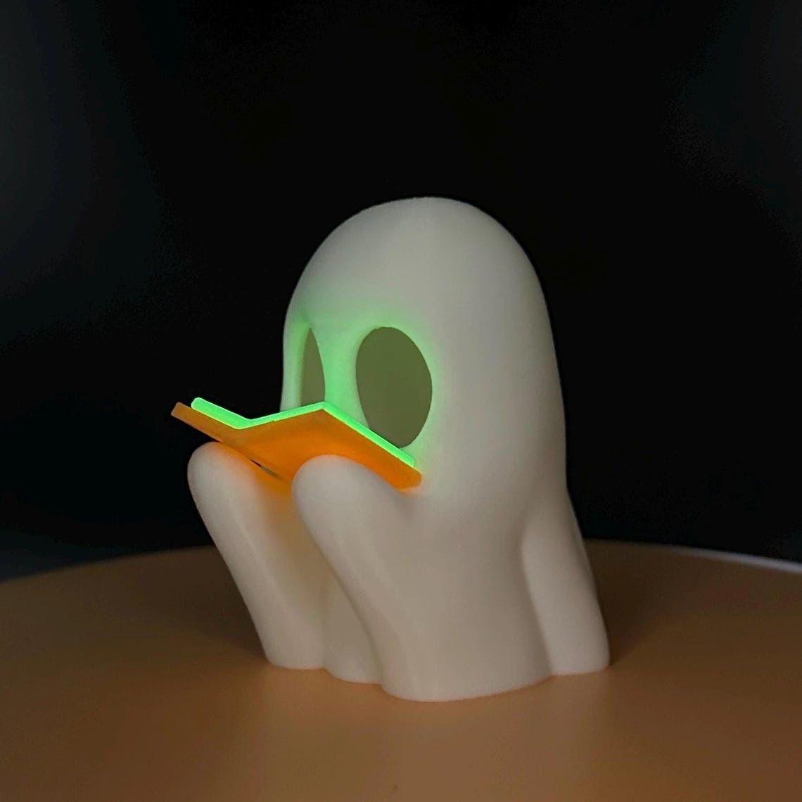 a 3d printed ghost reading a glowing book